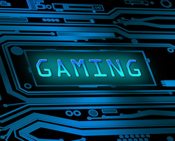 The image shows the word 'gaming' displayed on a blue motherboard.